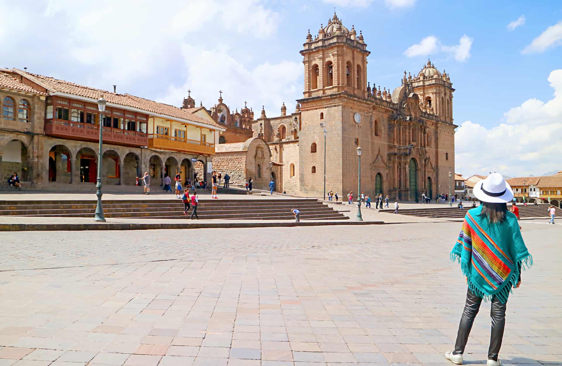 A tourist stares at the Cusco Cathedral